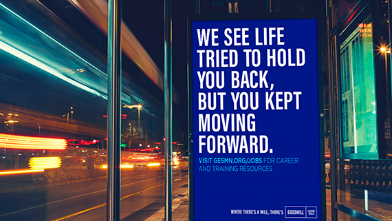 Billboard in bus stop shelter at night