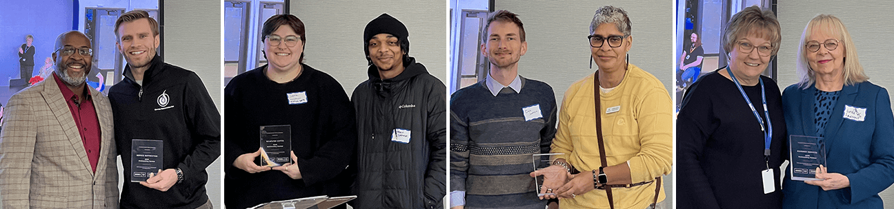 Photo of eight people holding awards for honors their companies received for partnering with Goodwill