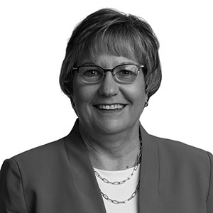 black and white portrait of Sheila Olson, the chief officer of programs at Goodwill-Easter Seals Minnesota